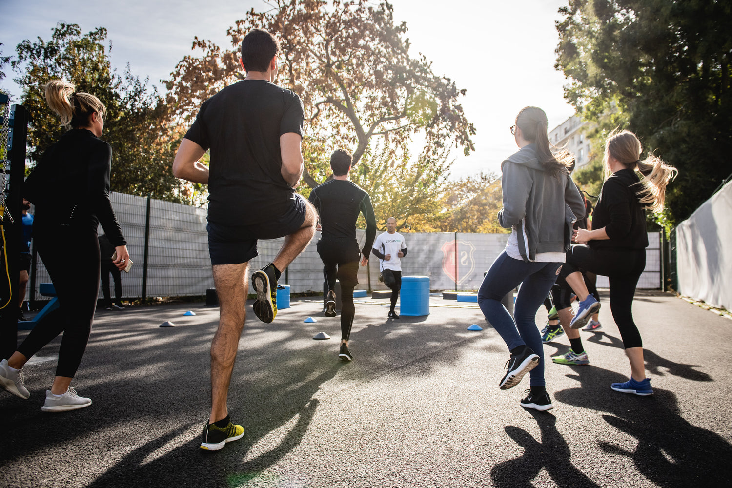 A fitness class warming up.